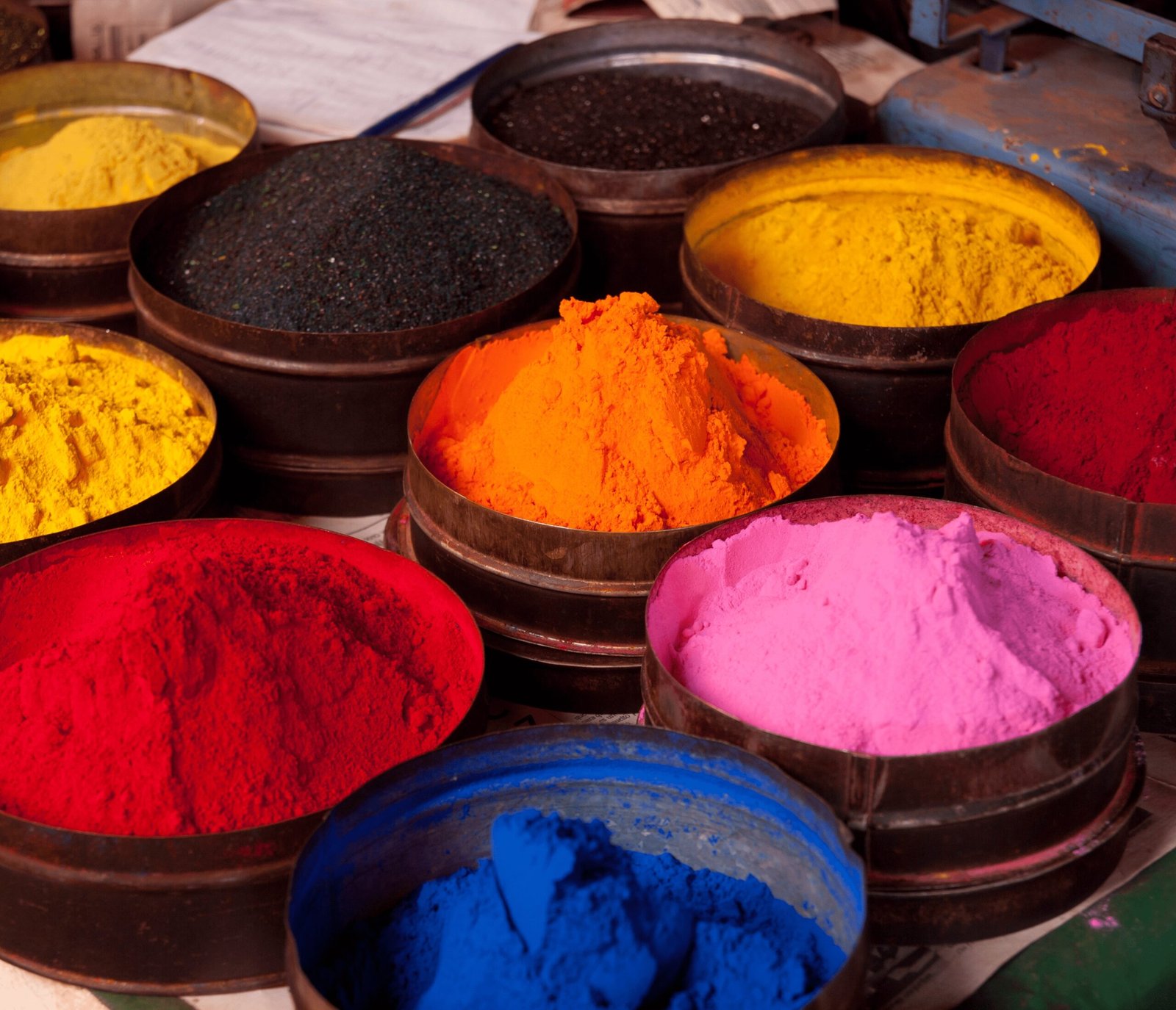 Colorful synthetic dyes used in synthetic clothing, posing health risks.